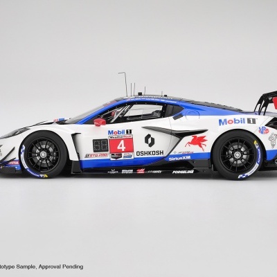 Carro de corrida de brinquedo branco, azul e preto com asa traseira vermelha e logótipos diversos