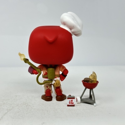 Boneco Funko Pop com mochila verde, lança-chamas e grelhador