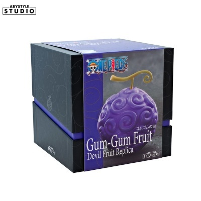 Embalagem de réplica do fruto Gum-Gum roxo com textura espiral e haste dourada