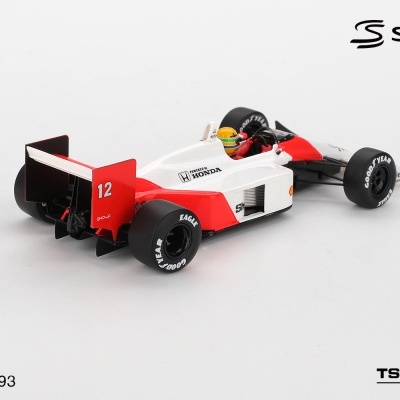 Miniatura branca e vermelha de carro de Fórmula 1 com pneus GOODYEAR e número 12.