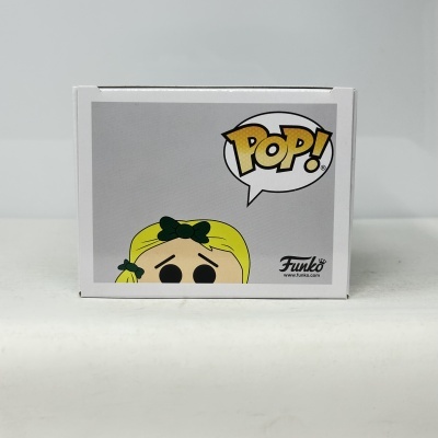 Caixa Funko Pop com personagem de cabelo amarelo e laços verdes