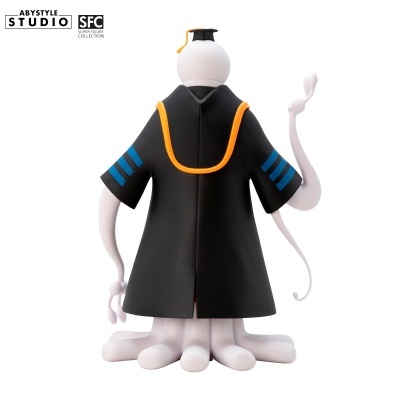 Figura decorativa branca com capa preta e chapéu de graduação