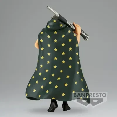 Figura de ação com capa de estrelas, segurando objeto cilíndrico