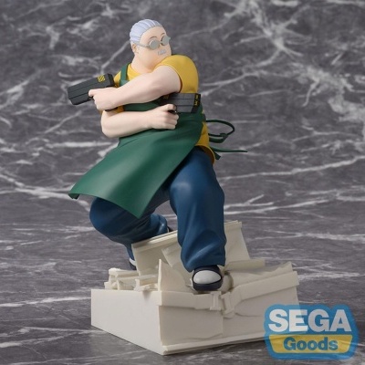 Figura de ação de um homem com avental verde segurando duas pistolas em base branca