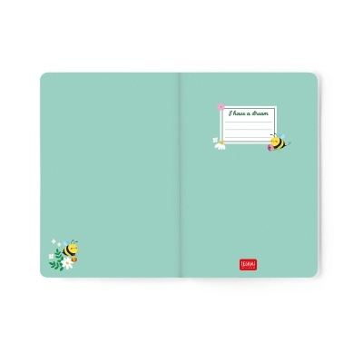Caderno verde água aberto com ilustrações de abelhas, flores e etiqueta com texto I have a dream