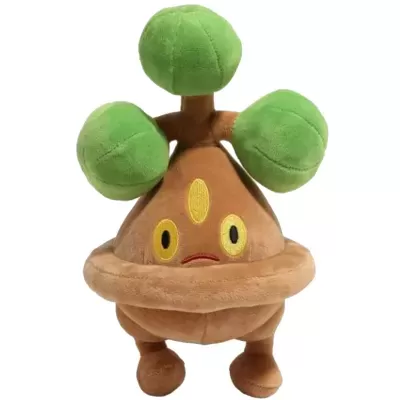 Pelúcia castanha com bolas verdes no topo e olhos amarelos