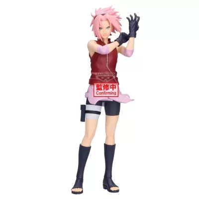 Figura colecionável de personagem com cabelo rosa e roupa vermelha e rosa