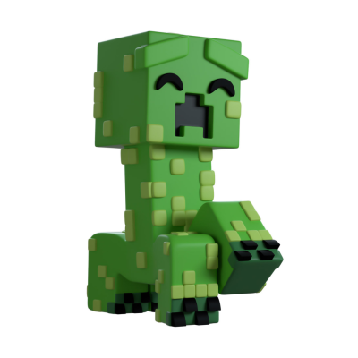 Figura de brinquedo verde pixelada com manchas amarelas e boca aberta