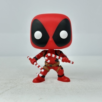Figura vinil Deadpool com bastões de doces listrados