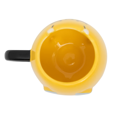 Vista superior de caneca cerâmica amarela com pega preta
