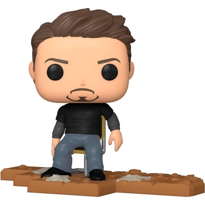 Figura colecionável de vinil Funko Pop sentado numa cadeira com chão de tijolos