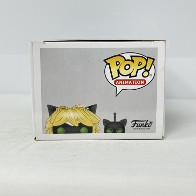 Caixa Funko Pop! Animation personagem com cabelo amarelo e máscara preta.
