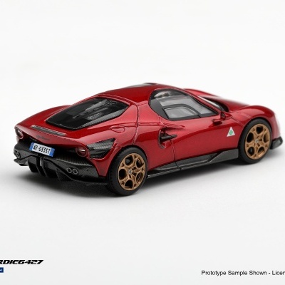 Miniatura de carro desportivo vermelho e preto com jantes douradas