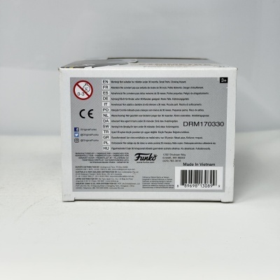 Caixa branca com texto multilingue, avisos de segurança e código de barras