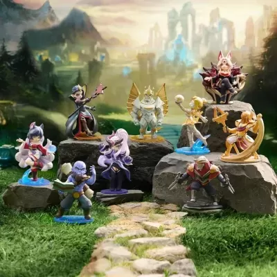 Miniaturas coloridas de personagens de fantasia sobre pedras em relva com fundo de montanhas e castelo