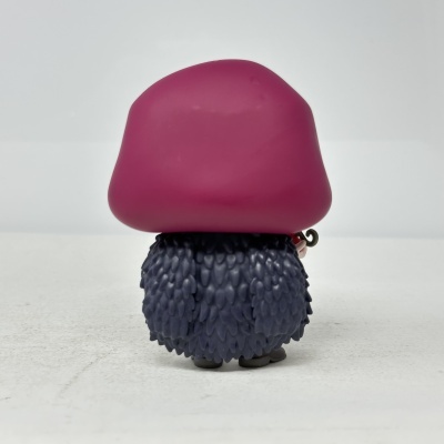 Figura de plástico com base cinzenta texturizada e topo vermelho arredondado