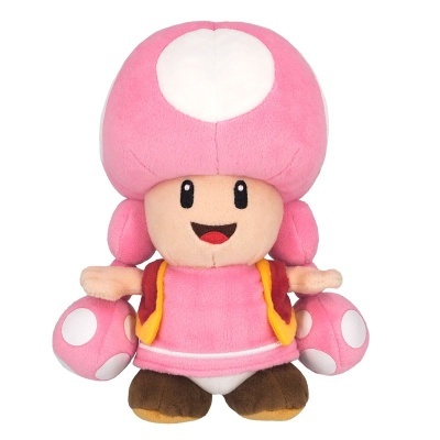 Pelúcia da personagem Toadette com cogumelos rosas e brancos e vestido rosa