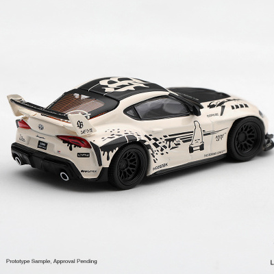 Miniatura de Toyota Supra bege com detalhes pretos e gráficos