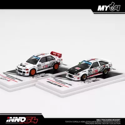Dois carros de slot Toyota Corolla AE86 Levin e Mitsubishi Lancer Evolution II com decoração branca e preta em bases brancas