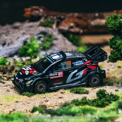 Miniatura de carro de corrida preto com logotipos e cenário natural em miniatura