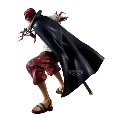 Figura de ação masculina com capa preta, calças vermelhas e sandálias pretas.