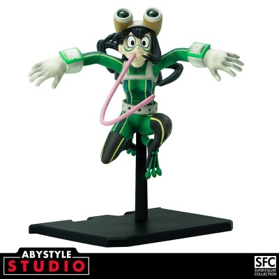 Figura de personagem com fato verde, língua rosa e base preta