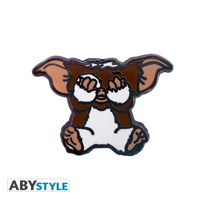 Pin metálico de personagem Gizmo com patas nos olhos sobre fundo branco