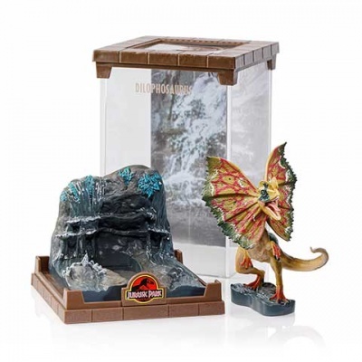 Figura de dinossauro com cenário Jurassic Park em plástico