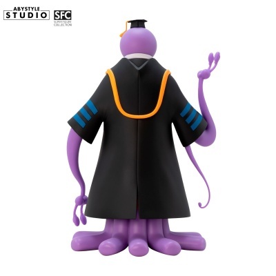 Figura de polvo roxo vestido com capa preta e chapéu de formatura.