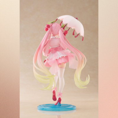 Figura colecionável feminina rosa com guarda-chuva detalhado numa base azul