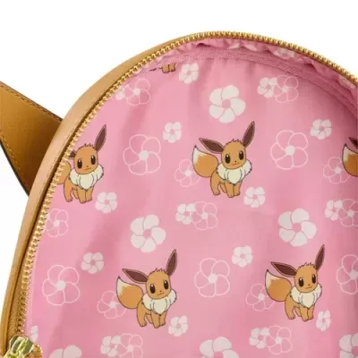 Interior de bolsa rosa com padrão de Eevee e flores brancas.