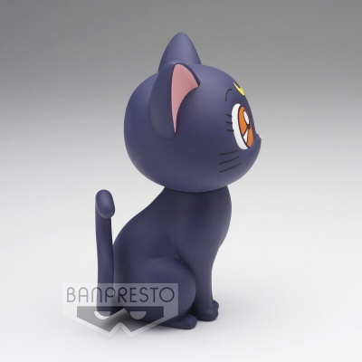 Figura de gato azul escuro estilizado sentado com olhos grandes e detalhes rosa nas orelhas