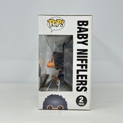 Caixa Funko Pop Baby Nifflers com figura visível pela janela.