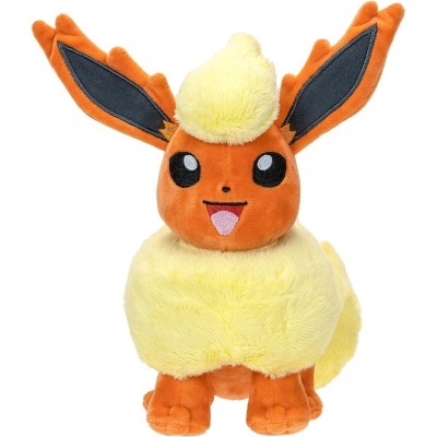 Pelúcia Flareon Pokémon laranja e amarelo com olhos pretos grandes