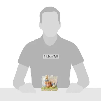 Figura decorativa de coelhos com livro 11,5 cm de altura.