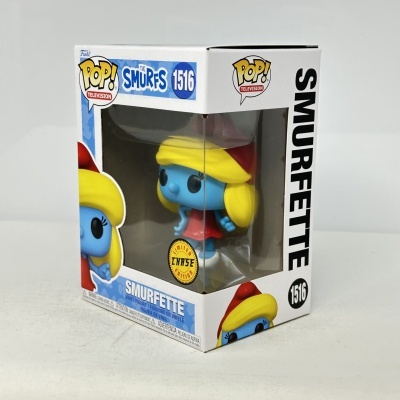 Funko Pop Smurfette vinil azul com cabelo amarelo e vestido vermelho na caixa
