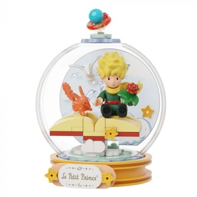 Globo de neve Le Petit Prince com figura do Pequeno Príncipe sentado num planeta amarelo