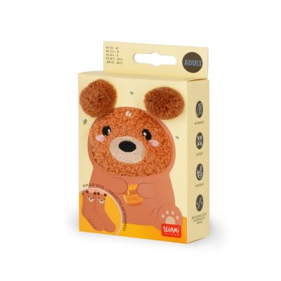 Embalagem amarela com meias antiderrapantes para adultos com desenho de urso castanho felpudo