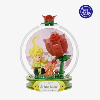 Figura decorativa em globo transparente com personagens de Le Petit Prince e base verde