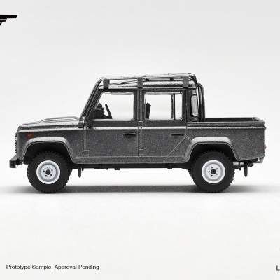 Miniatura cinzenta de Land Rover com quatro portas e caixa de carga