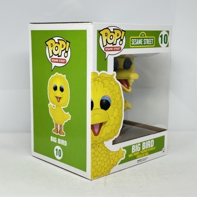 Figura de vinil Big Bird amarelo em caixa verde e branca da Sesame Street.