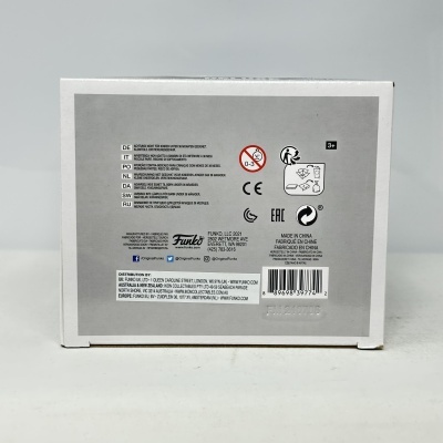 Parte traseira da embalagem de um produto Funko com avisos em várias línguas e código de barras.