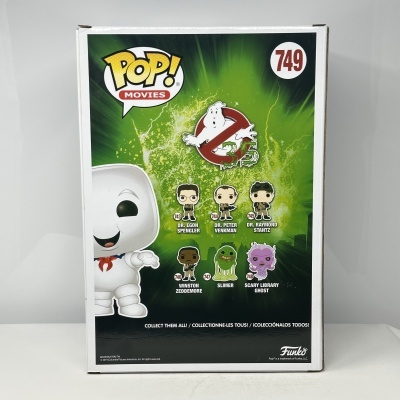 Embalagem Funko Pop! Movies 749 com personagens Ghostbusters em fundo verde e preto.