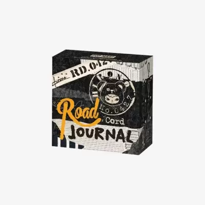 Caixa com design gráfico preto, branco e amarelo e texto Road cord JOURNAL