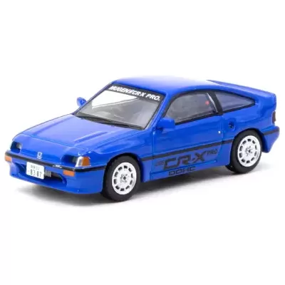 Miniatura de carro desportivo azul com texto MUGEN/CR-X PRO no vidro dianteiro