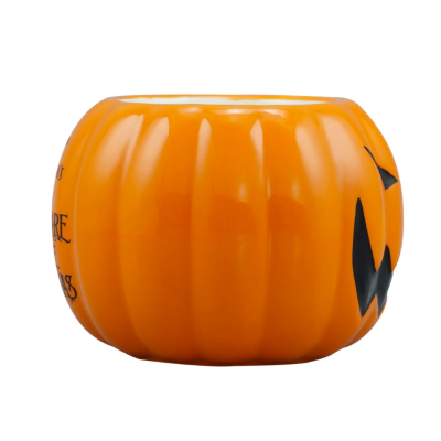 Vaso cerâmico em forma de abóbora laranja com rosto preto de Halloween