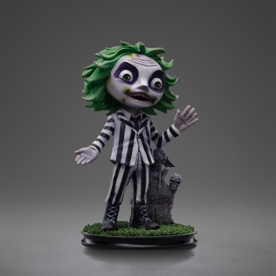 Figura colecionável de personagem com fato riscado e cabelo verde junto a lápide numa base circular