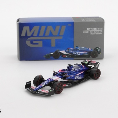 Miniatura de carro de Fórmula 1 azul e preto com caixa Mini GT