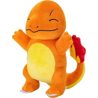 Peluche de Charmander laranja com barriga amarela e cauda em chamas.
