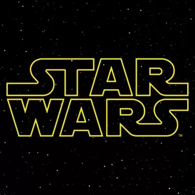 Logótipo amarelo luminoso 'STAR WARS' em fundo preto com estrelas brancas